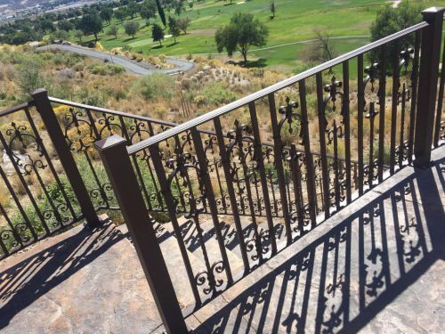 Iron deck railing by Taylor Made Iron Services.