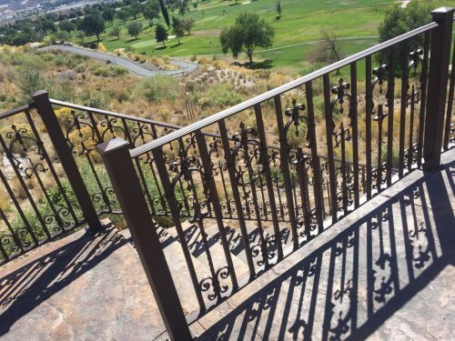 Iron deck railing by Taylor Made Iron Services.